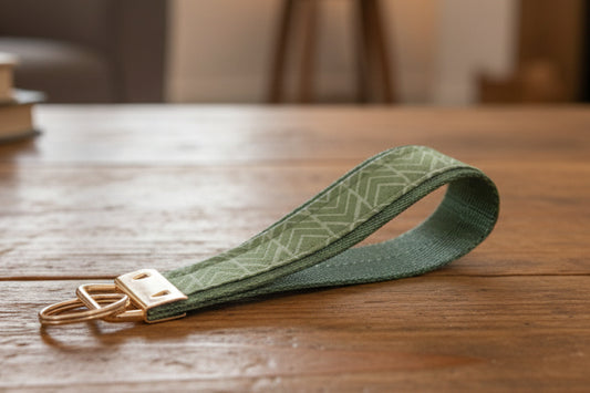Green fabric keychain with gold metal hardware