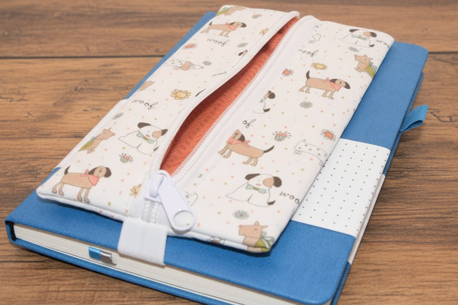Blue notebook with white pencil case with dog print