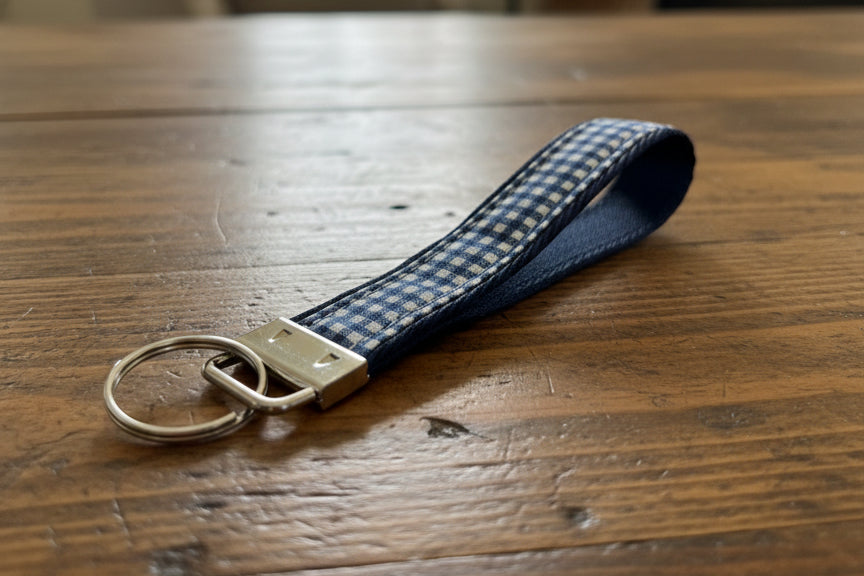 Blue and white checkered keychain with metal ring