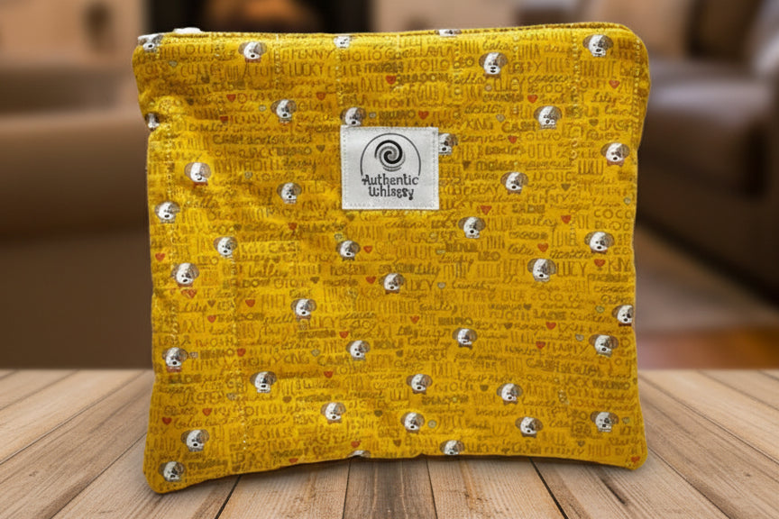 Yellow quilted pouch with dog fabric