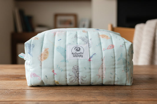 Floral-patterned pouch with sea creature fabric