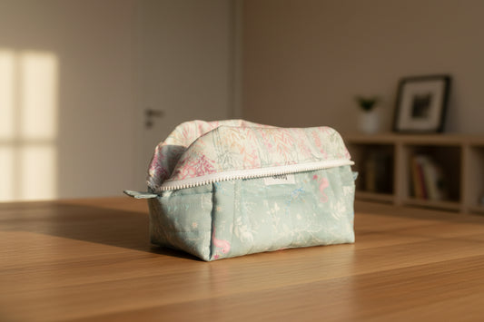 Fabric storage basket with floral pattern on a white surface