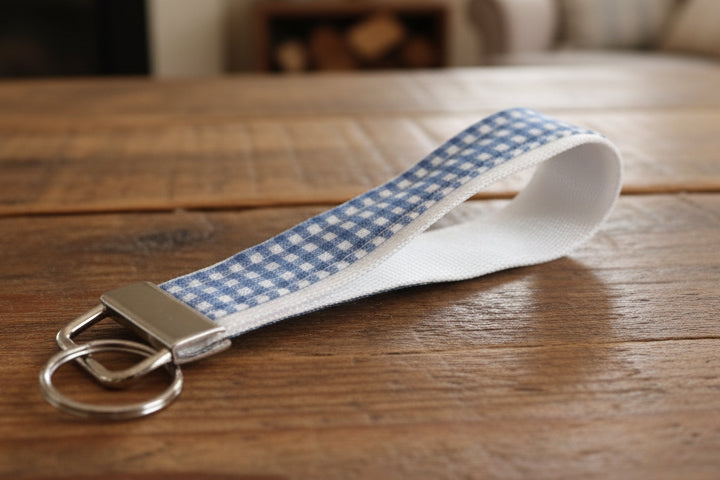 Keychain with a blue and white checkered  fabric on white strap