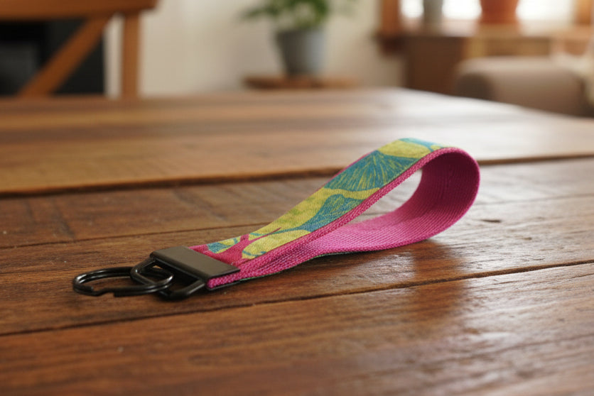 Green and magenta keychain with black hardware