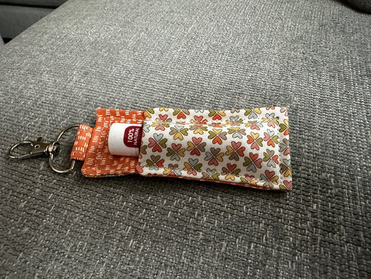 Lip Balm Holder - Multi-Color Clover Fabric with Orange Interior