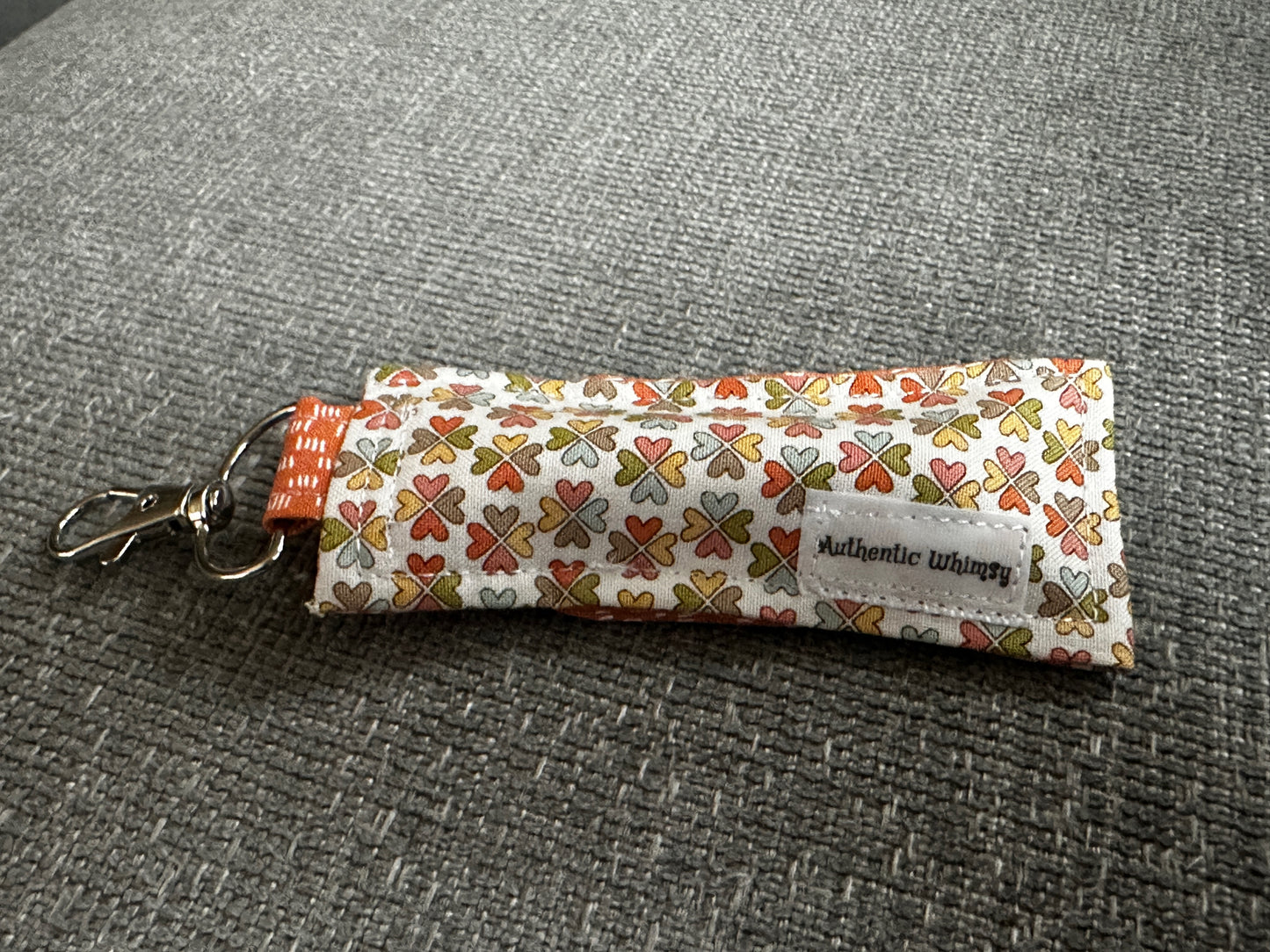 Lip Balm Holder - Multi-Color Clover Fabric with Orange Interior