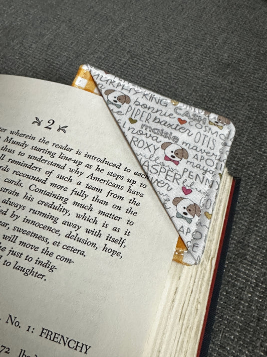 Book with a bookmark featuring cartoon characters on a textured surface