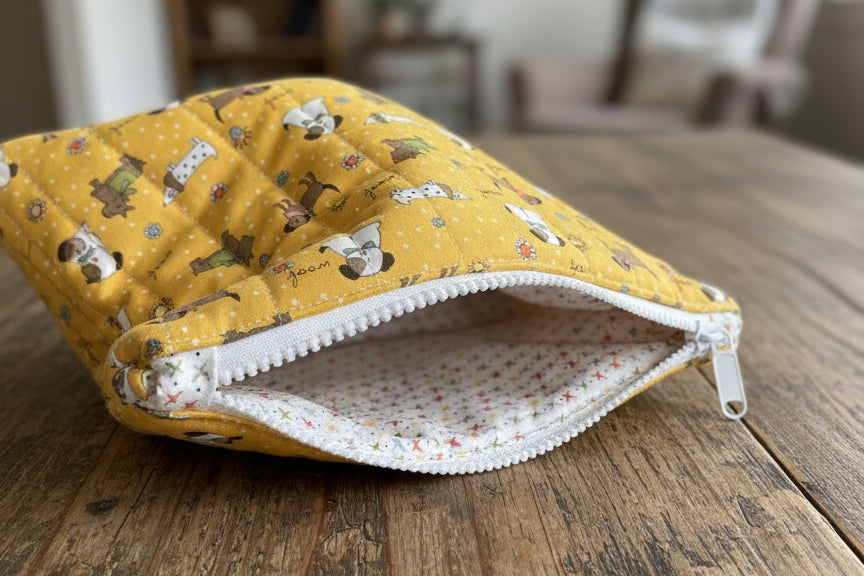 Yellow zipper bag with dog pattern