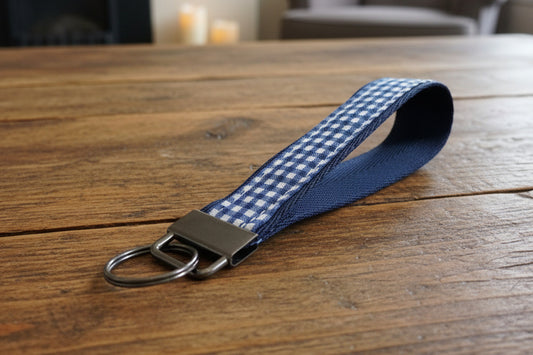Keychain with blue and white checkered strap 