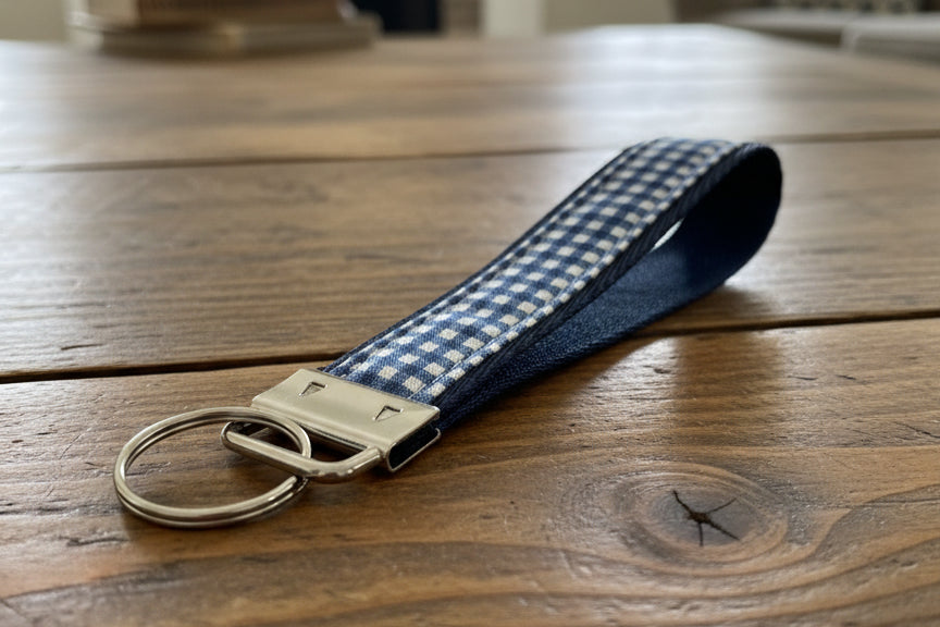 Blue and white checkered keychain with a metal ring 