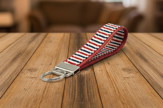 Keychain with red, white, and blue striped pattern with silver hardware